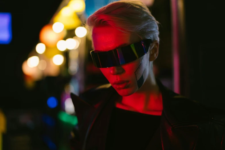 a close up of a person wearing a pair of sunglasses, cyberpunk art, by Adam Marczyński, trending on pexels, cyberpunk night street, attractive androgynous humanoid, wearing futuristic clothing, bisexual lighting