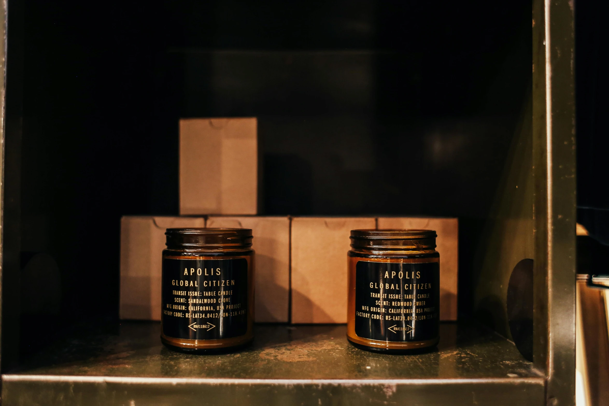 a couple of candles sitting on top of a shelf, a portrait, unsplash, bauhaus, celebration of coffee products, oil glaze, labels, mid shot photo