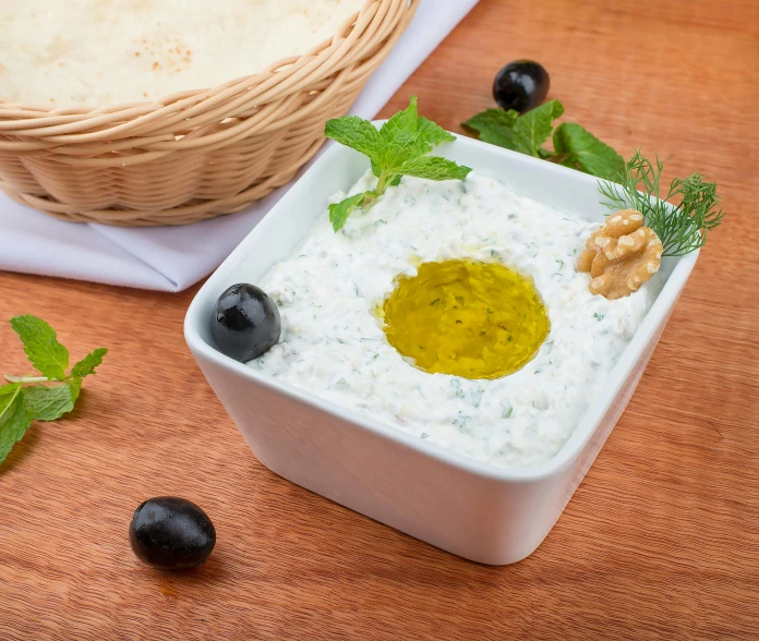 a close up of a bowl of food on a table, inspired by Ceferí Olivé, shutterstock, dau-al-set, greek white marble, square, islamic, 2995599206