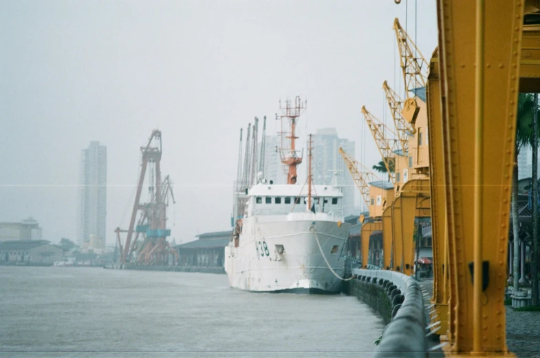 a large white boat in a body of water, a colorized photo, inspired by Elsa Bleda, pexels contest winner, hyperrealism, shipping docks, shanghai, photo taken on fujifilm superia, portrait of a big