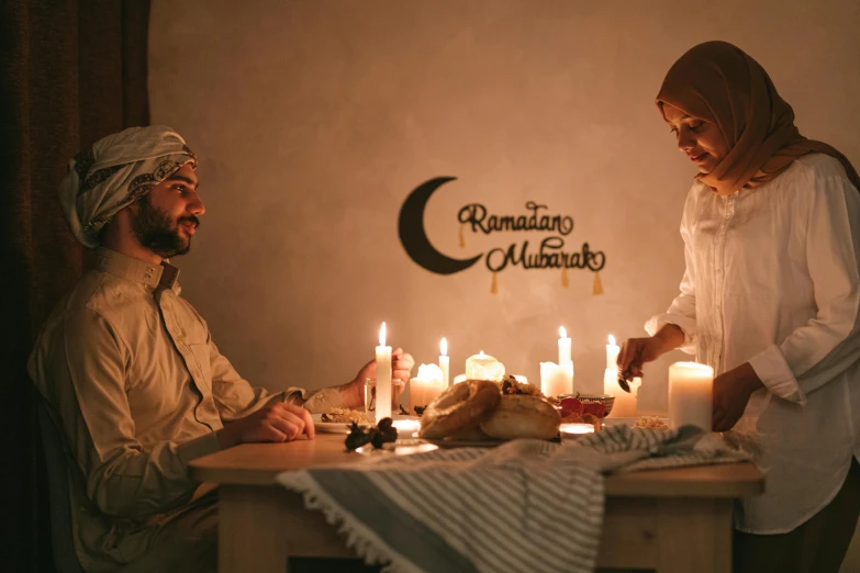 a man and a woman sitting at a table with candles, pexels contest winner, hurufiyya, islamic, ☁🌪🌙👩🏾, celebrating, promotional photo