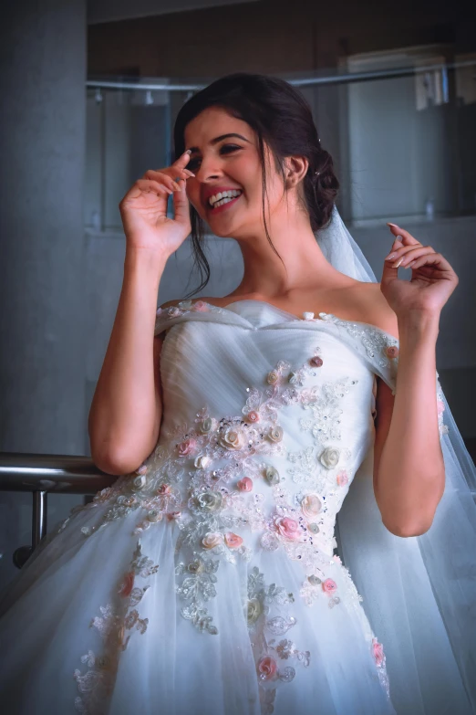 a woman in a wedding dress talking on a cell phone, by Farid Mansour, arabesque, dramatic smile pose, isabela moner, floral couture, closeup - view