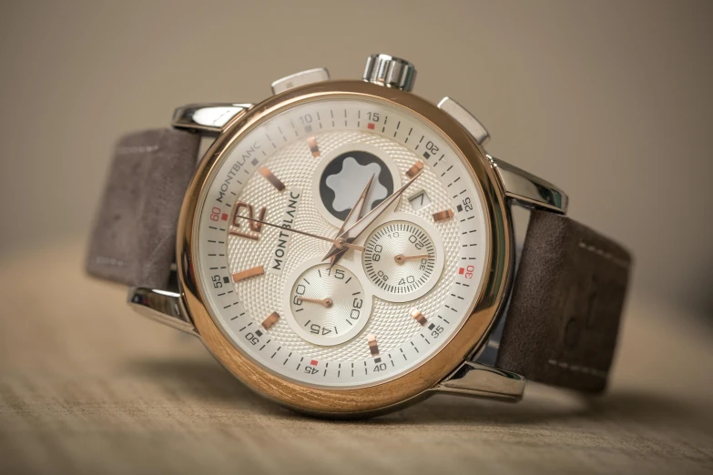 a close up of a watch on a table, a portrait, inspired by Eugène Brands, unsplash, gradient brown to white, highly realistic”, grain”, ivory and copper