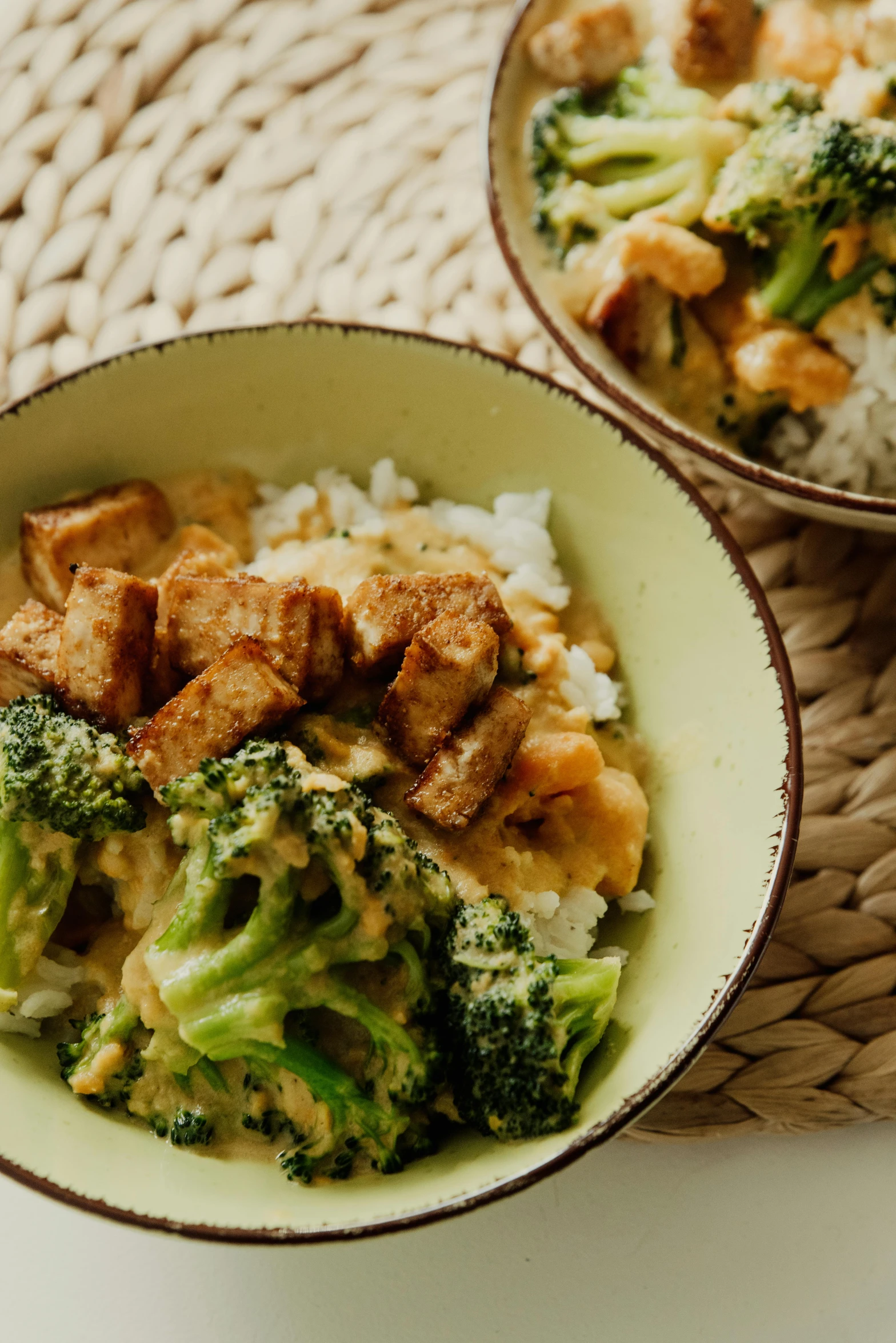 a close up of two bowls of food on a table, inspired by Li Di, unsplash, broccoli, square, beige, thai