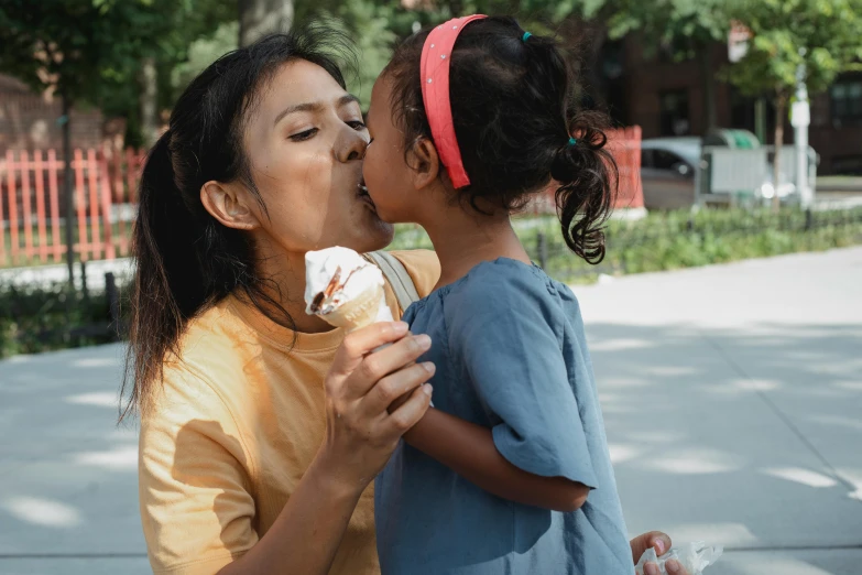 a woman kissing a little girl on the cheek, pexels contest winner, ice cream cone, thumbnail, hispanic, cinematic full shot