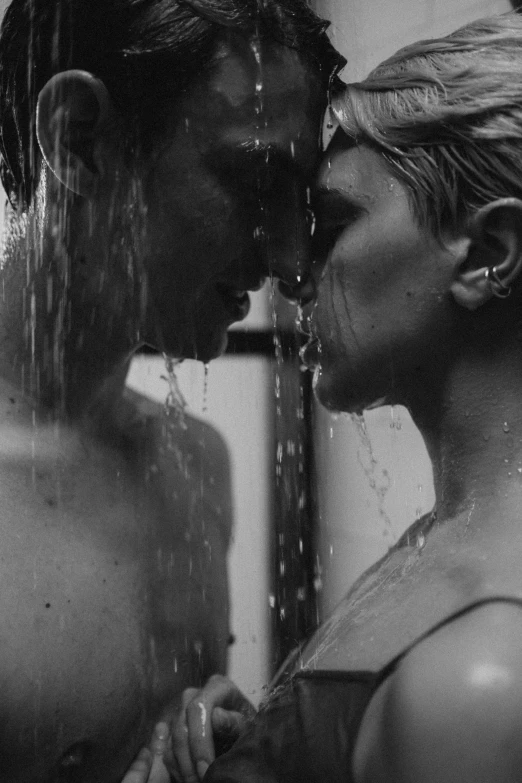 a black and white photo of a man and a woman in the shower, tumblr, romanticism, close-up!!!!!!, ffffound, joel fletcher, it\'s raining