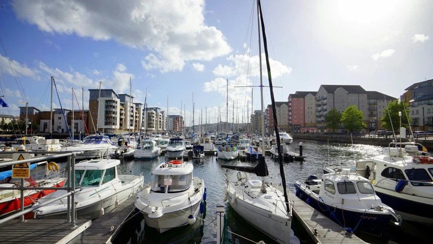 a harbor filled with lots of white and blue boats, a cartoon, unsplash, happening, wales, aardman studios, at the waterside, thumbnail