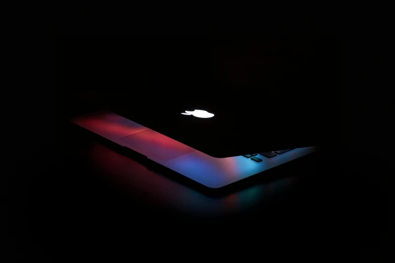 a close up of a laptop in the dark, a hologram, pexels, apple design, red and blue back light, iphone picture, product lighting