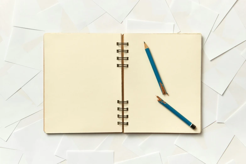 an open notebook with a pencil on top of it, inspired by artist, overhead birdseye view, pale blue, parchment, modelling