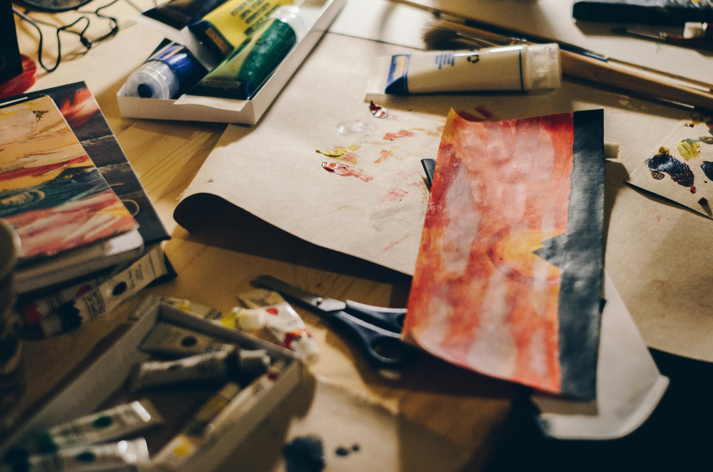 a wooden table topped with lots of art supplies, inspired by artist, pexels contest winner, paint knife, unfinished canvas, ink and paper, trending on