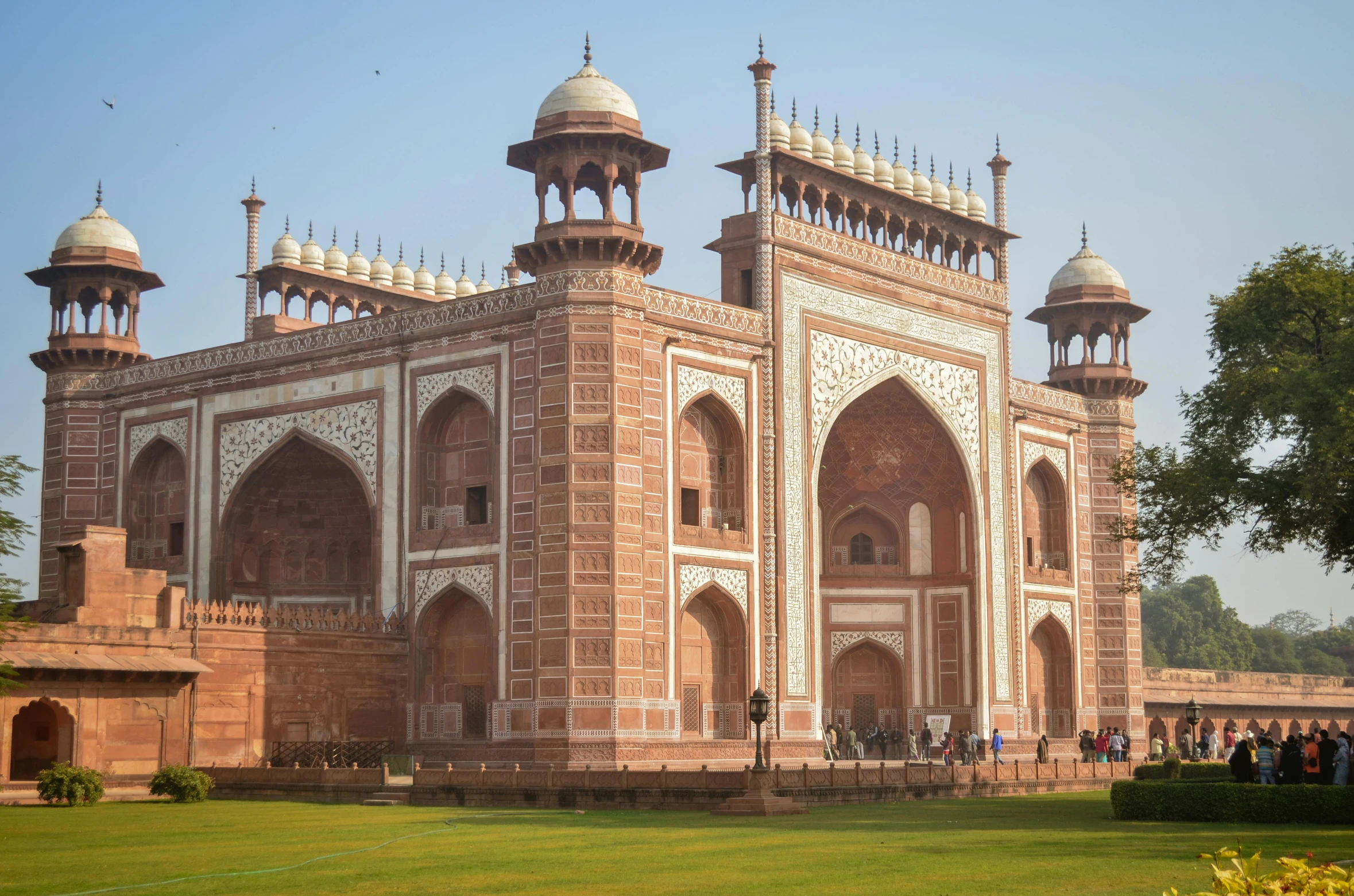 a large building sitting on top of a lush green field, a picture, renaissance, taj mahal, an archway, huge gate, thumbnail