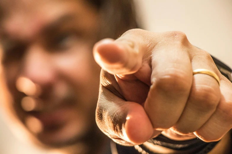 a close up of a person pointing a finger at the camera, by Adam Marczyński, matt berry, an angry, avatar image, drunken fist
