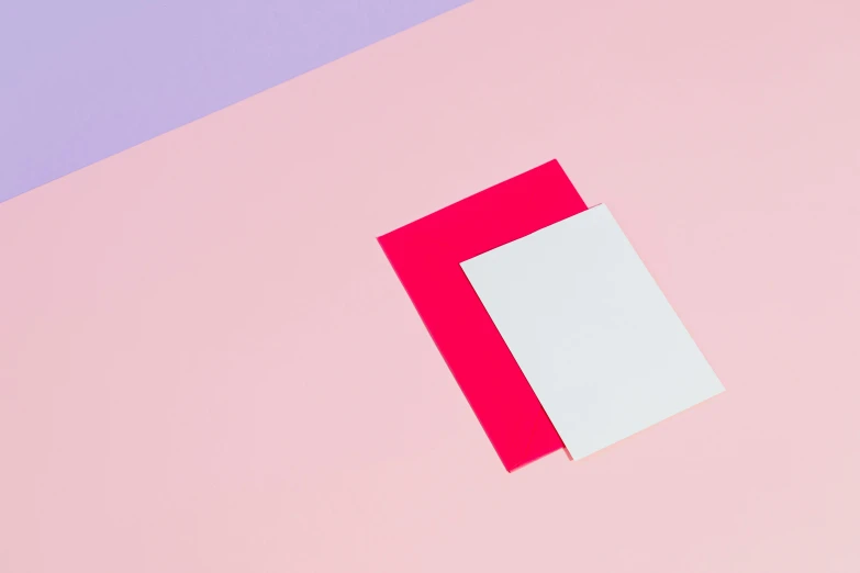 a piece of paper sitting on top of a pink and blue surface, inspired by Josef Albers, trending on unsplash, color field, red and white neon, pair of keycards on table, abstract wallpaper design, square shapes
