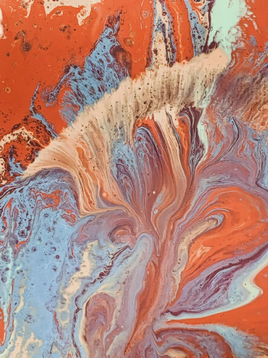 a close up of a piece of art on a table, by Lee Loughridge, trending on unsplash, metaphysical painting, melting in coral pattern, sand swirling, orange and blue color scheme, earth tones and soft color 1976