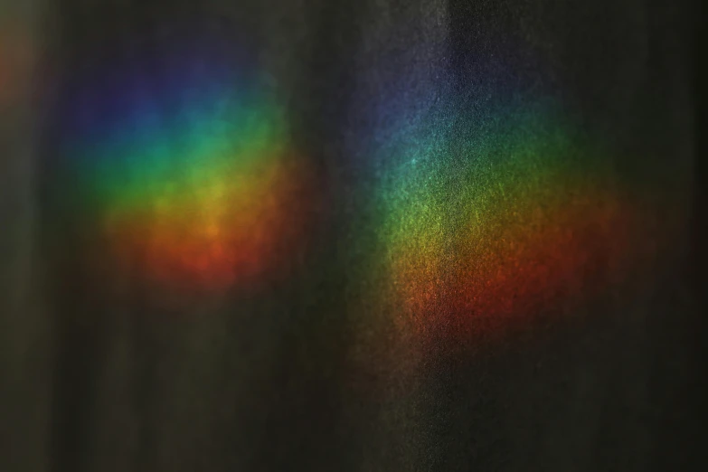 a close up of a curtain with a rainbow on it, a hologram, trending on pexels, camera glare in oil style, glowing black aura, spray paint texture, muted colours 8 k