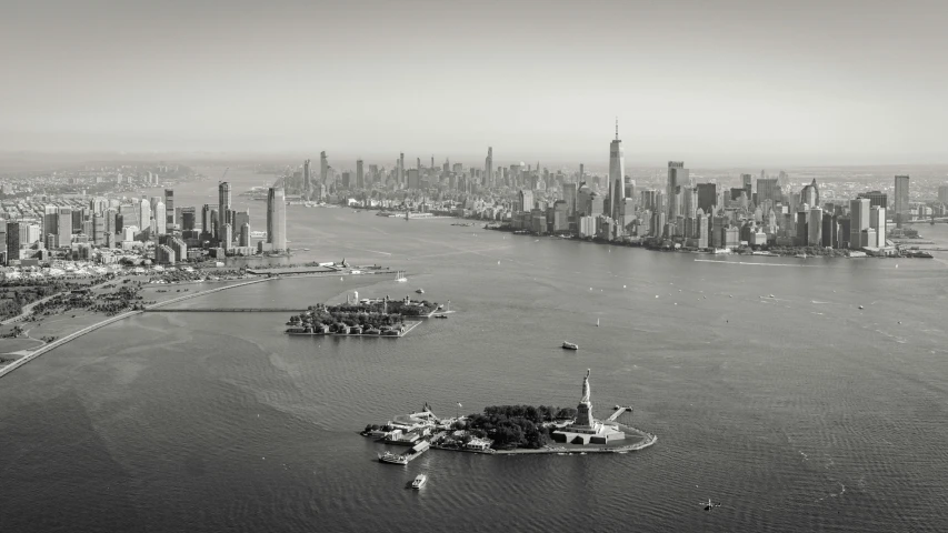 an aerial view of a city and a body of water, a black and white photo, by Daniel Lieske, pexels contest winner, statue of liberty, 15081959 21121991 01012000 4k, jia ruan, an island