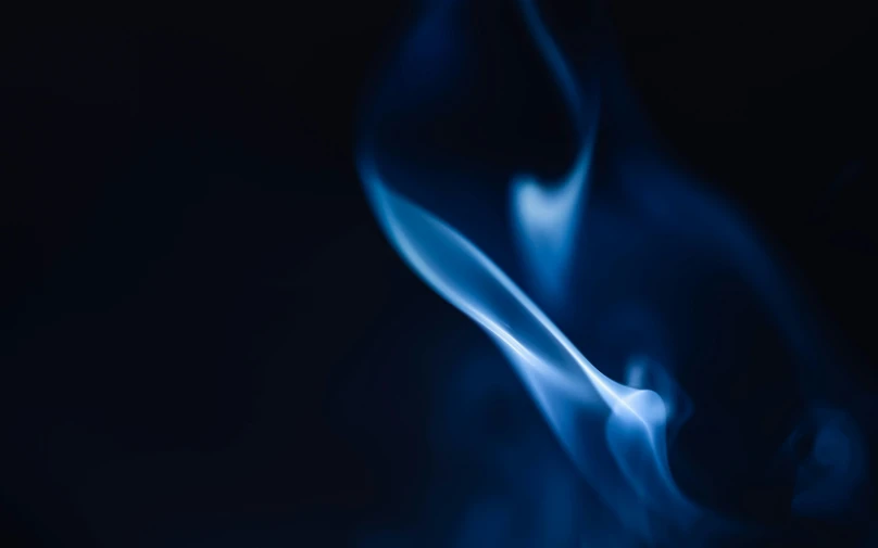 a close up of blue smoke on a black background, a macro photograph, by Daniel Lieske, pexels, flame and fire, blue blurred, instagram post, profile picture