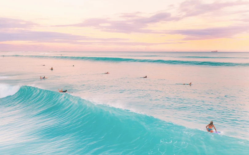 a group of people riding waves on top of surfboards, by Maggie Hamilton, unsplash contest winner, minimalism, turquoise and pink lighting, australian beach, iridescent shimmering pools, lined up horizontally