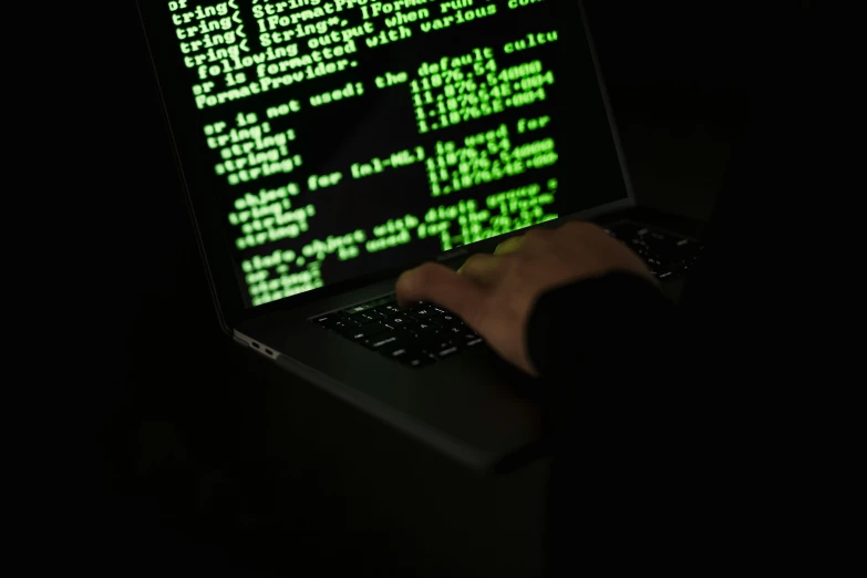 a person typing on a laptop in the dark, an scp anomalous object, mystery code, promo image, instagram post