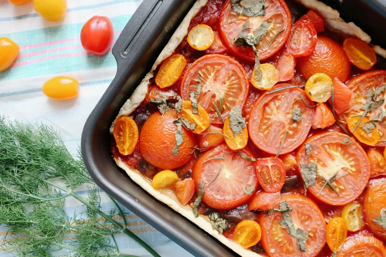 a pan filled with tomatoes sitting on top of a table, by Carey Morris, pexels contest winner, pizza pie, square, thumbnail, pastelle