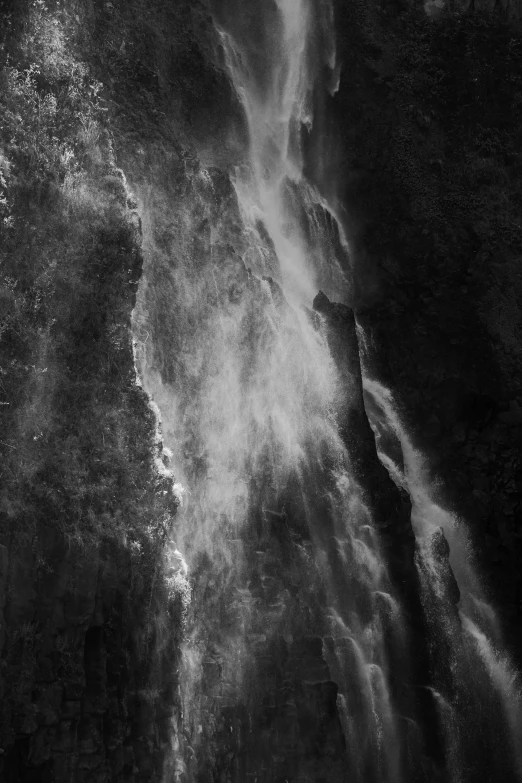 a black and white photo of a waterfall, a black and white photo, inspired by Edward Weston, lyrical abstraction, nebula waterfalls, sun lit, close-up!!!!!, edward weston and gustave doré