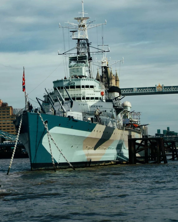 a large boat sitting on top of a body of water, a colorized photo, by IAN SPRIGGS, unsplash, graffiti, battleship, lgbtq, spitfire, instagram story