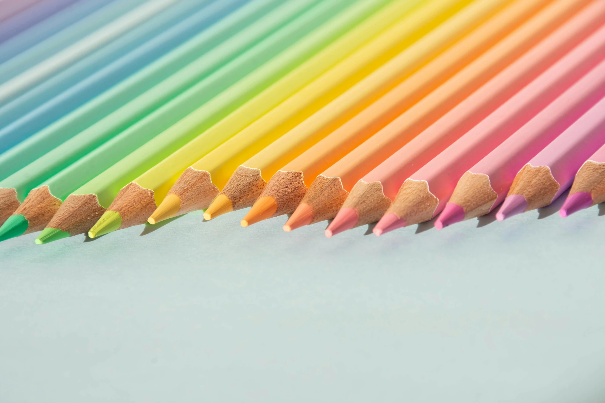 a group of colored pencils sitting next to each other, by Rachel Reckitt, trending on pexels, crayon art, pale pastel colours, neon pastel, perfect symmetrical image, angular 16-color