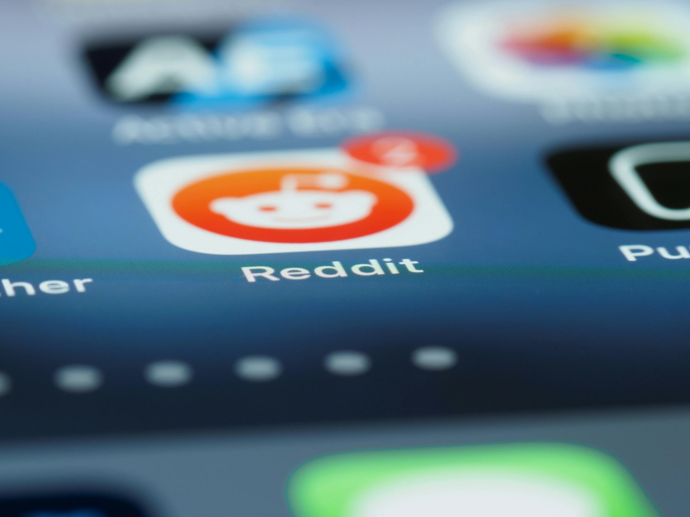 a close up of a cell phone with various apps on it, trending on reddit, kodak stock, reddish beard, blurred photo, ios app icon