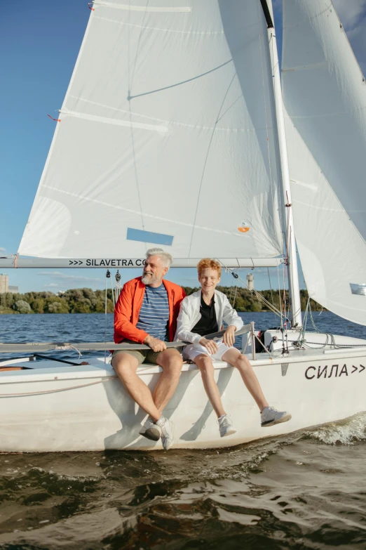 a man and a woman sitting on a sailboat, by Ilya Ostroukhov, unsplash, fine art, with names, low quality photo, older male, white cyc