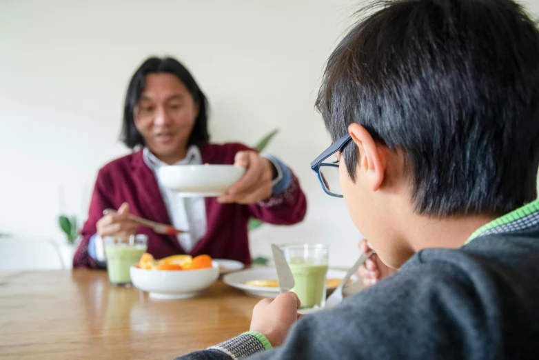 a couple of people that are sitting at a table, pexels contest winner, fatherly, ready to eat, darren quach, at home