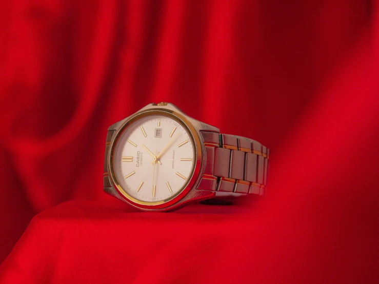 a close up of a watch on a red cloth, pexels contest winner, magic realism, gradient white to gold, plain background, thumbnail, japanese