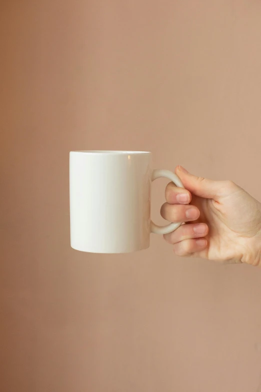 a person holding a coffee cup in their hand, by Doug Ohlson, minimalism, ivory, made of glazed, full product shot, exquisite handle