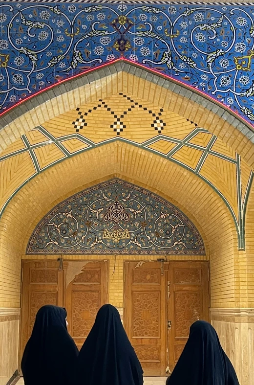 a couple of women that are standing in front of a building, inspired by Kamāl ud-Dīn Behzād, flickr, mosque interior, 256x256, an archway, khomeini