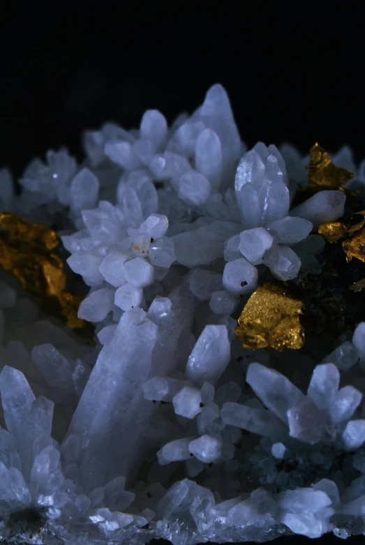 a cluster of crystals sitting on top of a rock, by Jessie Algie, touches of gold leaf, ari aster, whites, high-quality photo