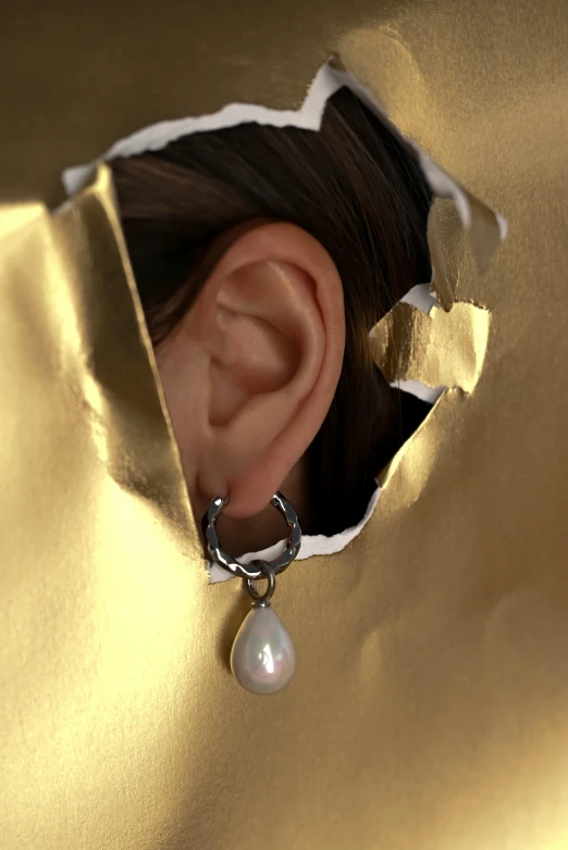 a close up of a person wearing a pair of earrings, an album cover, inspired by Louis Le Nain, hyperrealism, pearlescent skin, torn, studio product shot, pearl earring