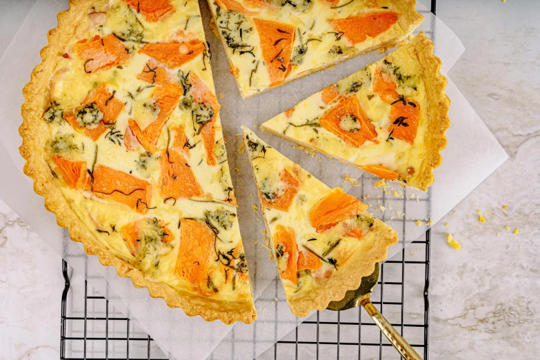 a close up of a pie on a cooling rack, a pastel, hurufiyya, salmon, flatlay, coronation, pumpkin