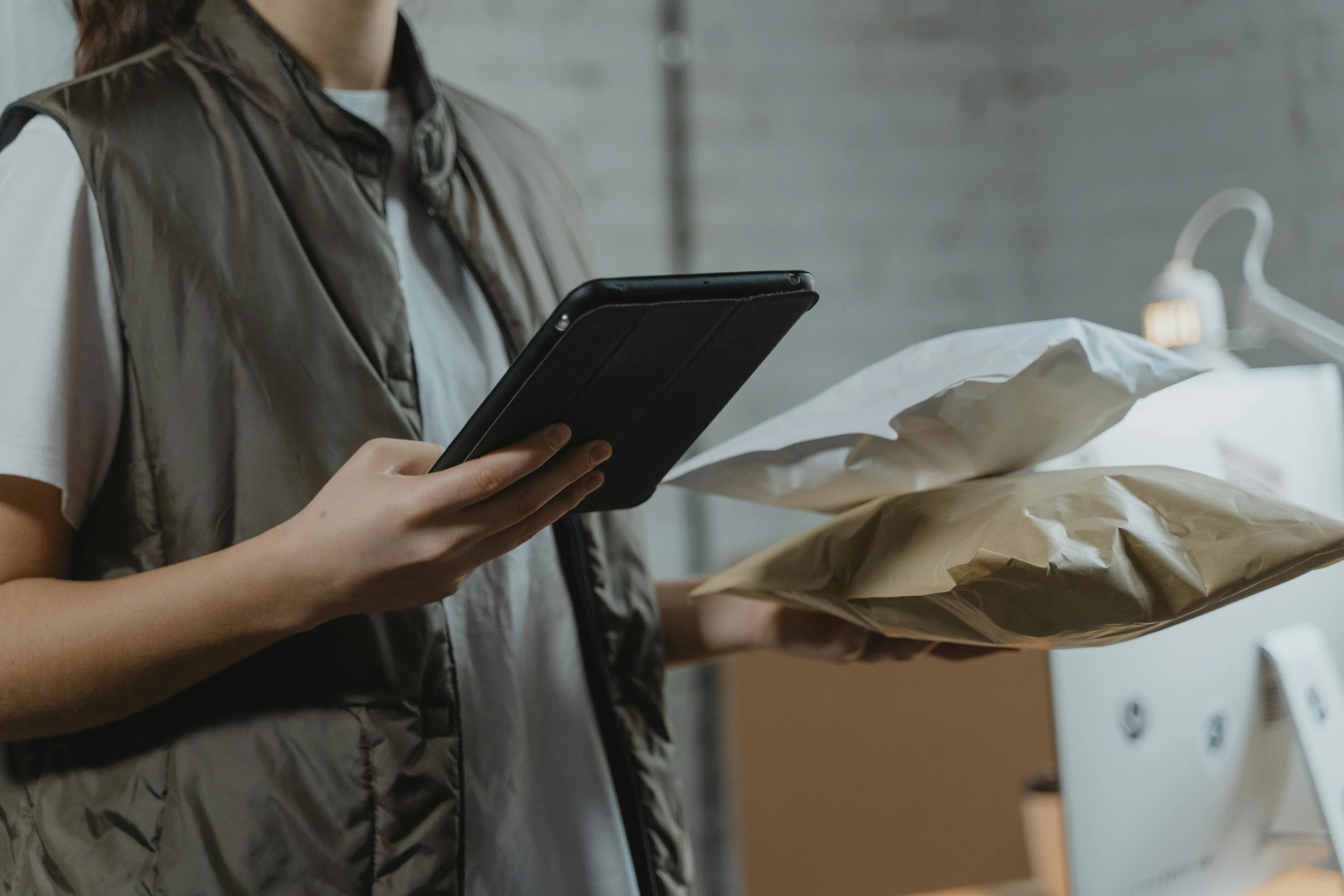 a woman holding a piece of paper in her hands, by Joseph Severn, pexels contest winner, scanning items with smartphone, delivering mail, a handsome, using a magical tablet