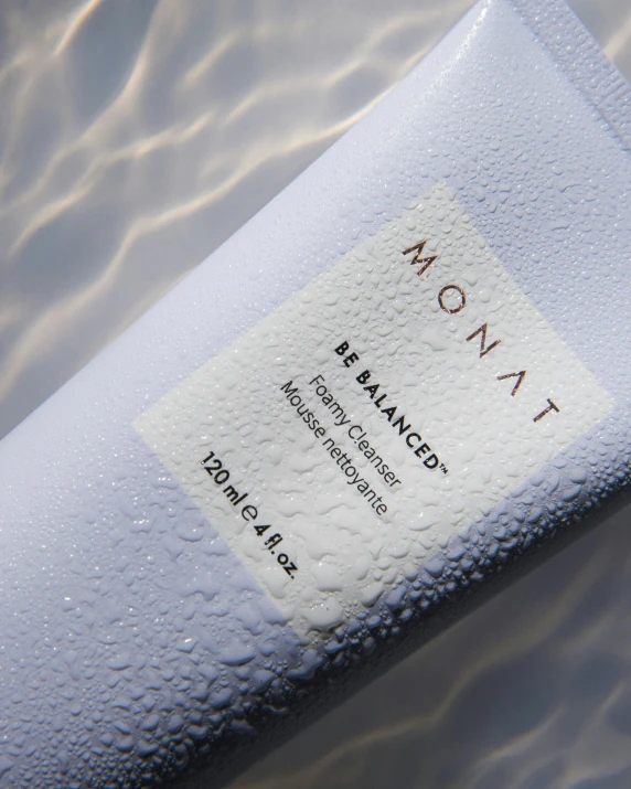 a tube of water sitting on top of a table, detailed product image, skin detail, nomad masterpiece, balance