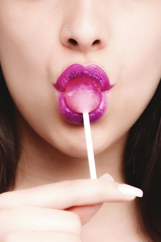 a close up of a person holding a lollipop, inspired by Bert Stern, purple lipstick, kiss mouth to mouth, bubble, marshmallow