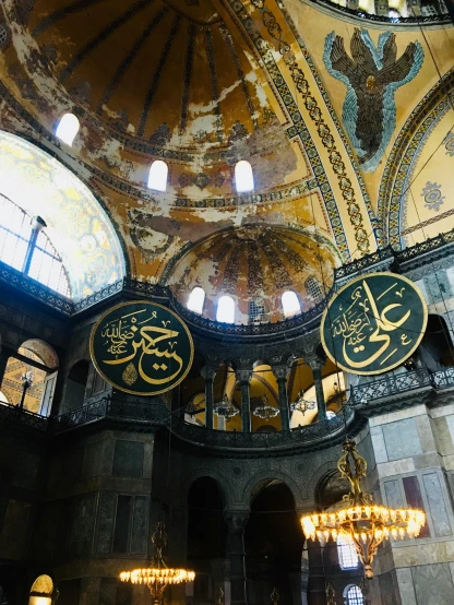 a group of people standing inside of a building, a mosaic, inspired by Osman Hamdi Bey, trending on unsplash, hurufiyya, with great domes and arches, 2 5 6 x 2 5 6 pixels, gold decorations, intense sunlight