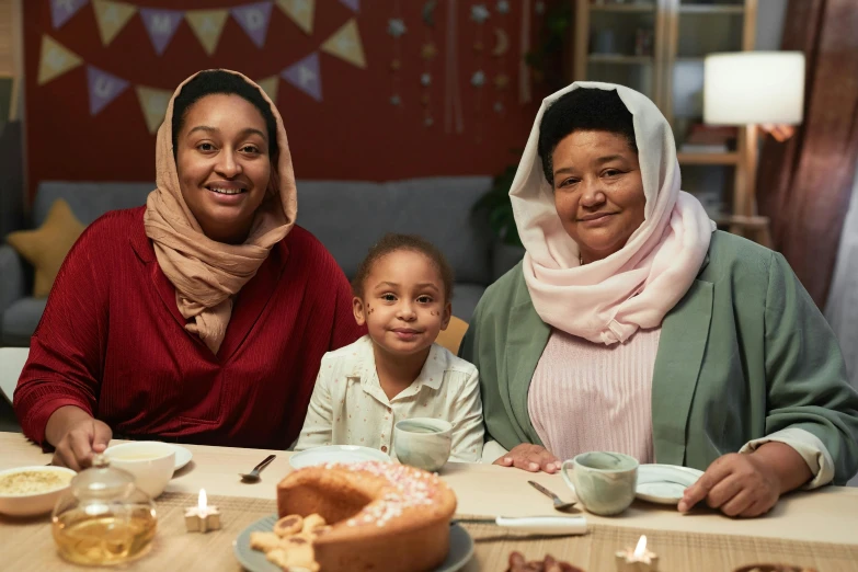 a woman and two children sitting at a table with food, shutterstock contest winner, hurufiyya, diverse outfits, close together, modest, wearing festive clothing