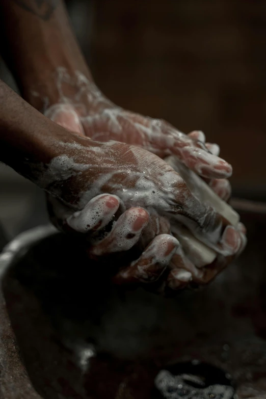a person washing their hands with soap, by Joe Stefanelli, award winning cinematic still, hard clay, zulu, single pair of hands