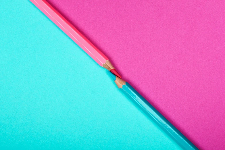 a pencil on a pink and blue background, an album cover, trending on pexels, synchromism, red and teal color scheme, split - complementary - colors, caran d'ache luminance, close together