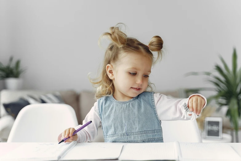 a little girl sitting at a table with a pencil in her hand, pexels contest winner, white sketchbook style, looking her shoulder, she has two ponytails, thumbnail