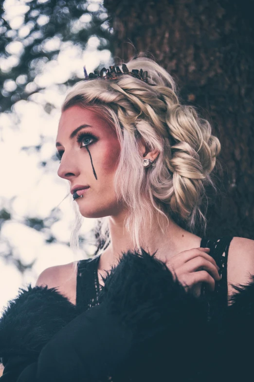 a woman in a black dress standing next to a tree, a portrait, inspired by Elsa Bleda, pexels contest winner, white braided hair, jessica nigri, crying queen of feathers, headshot profile picture