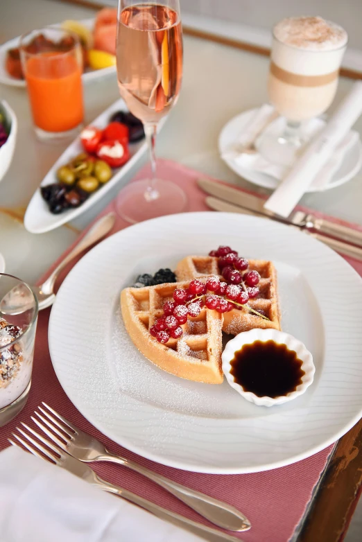 a white plate topped with waffles and fruit, renaissance, dubai, sparkling, morning mood, made of glazed