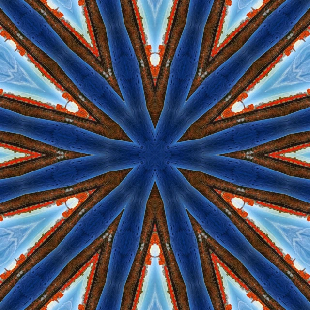 a close up of a blue and brown pattern, by Jan Rustem, flickr, centered radial design, orange and blue sky, digitalt art, colors red white blue and black