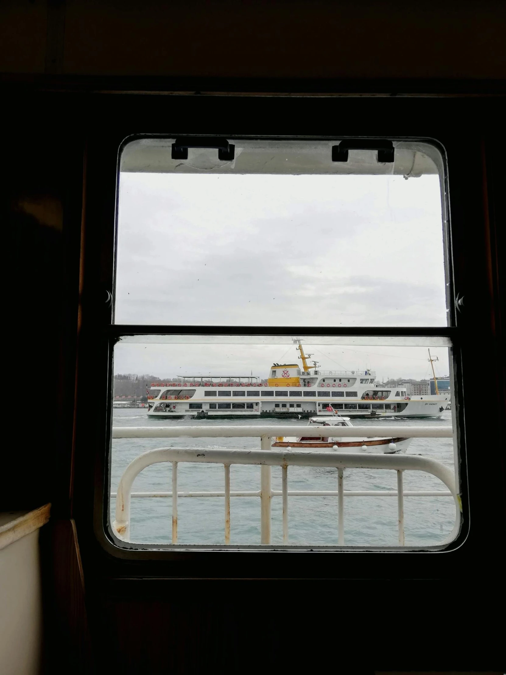 a view of a cruise ship through a window, hurufiyya, istanbul, 🚿🗝📝, 2022 photograph, high quality picture