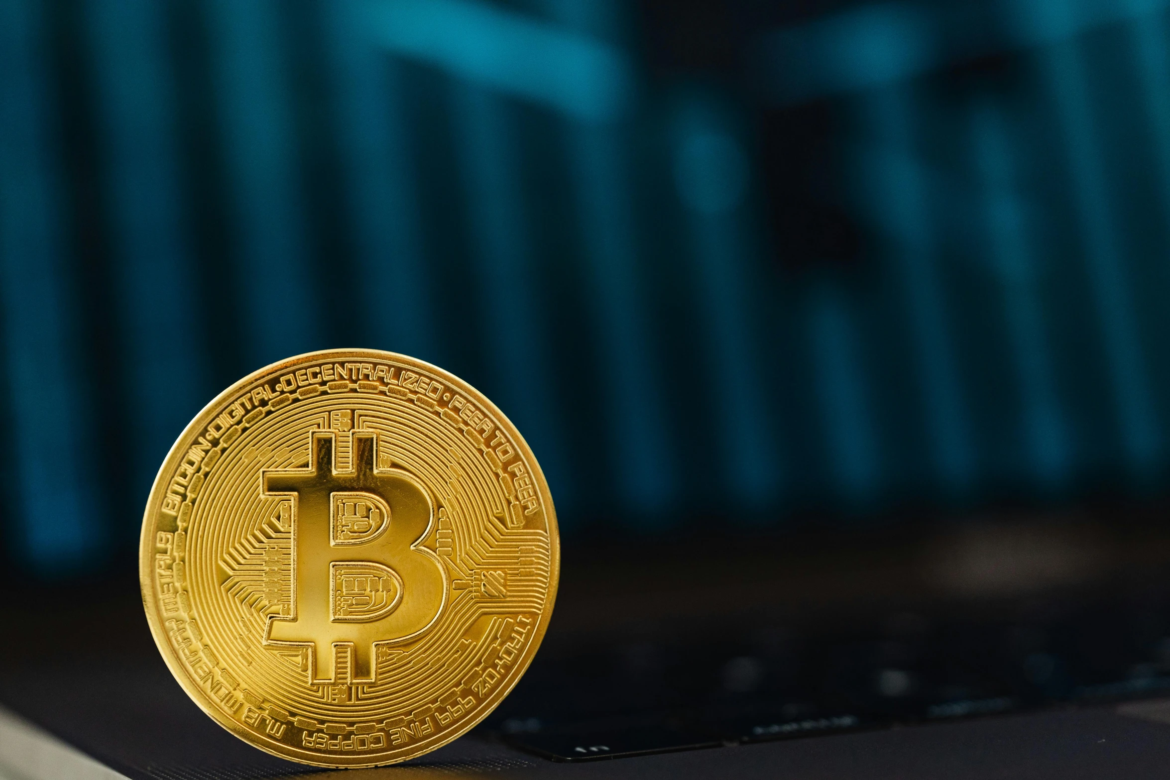 a golden bit coin sitting on top of a laptop, trending on pexels, renaissance, background image, cyan, thumbnail, rectangle