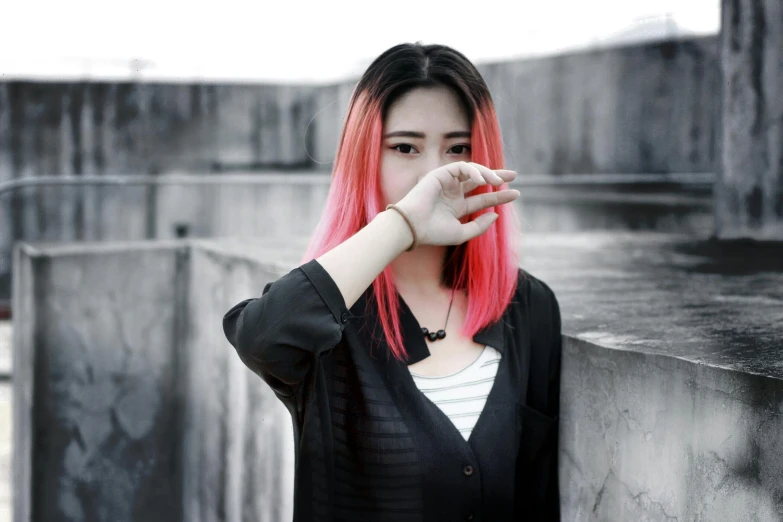 a woman with pink hair posing for a picture, a black and white photo, inspired by Elsa Bleda, pexels contest winner, aestheticism, young asian girl, gradient red to black, with fingers, threatening pose